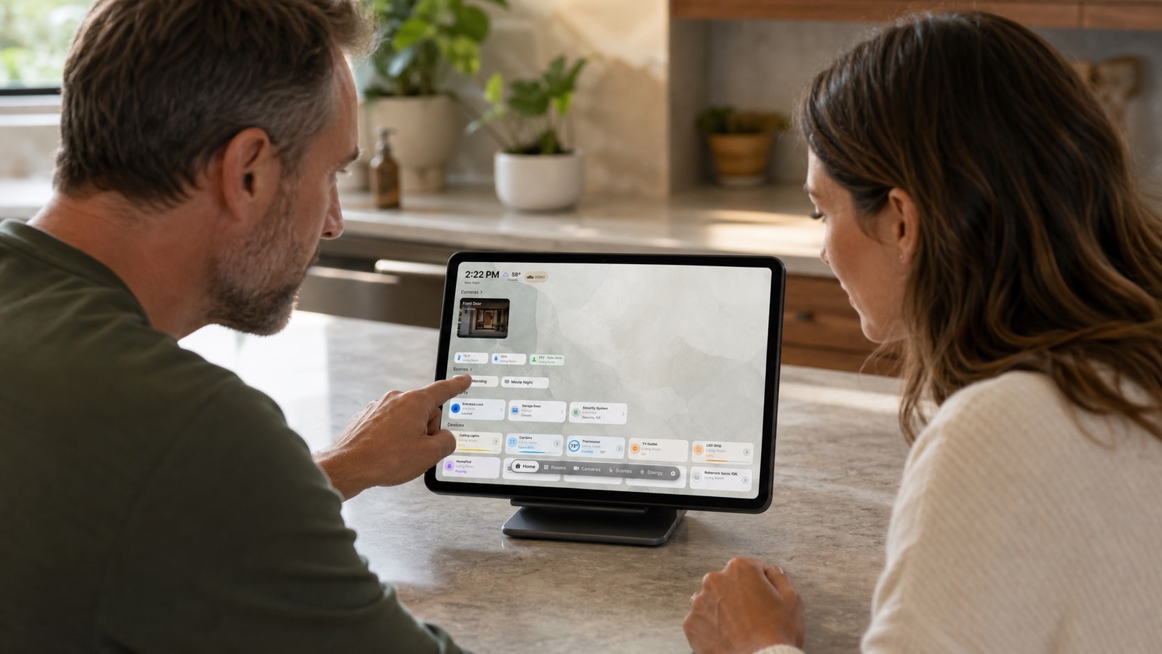 Two adults configuring a shared HomeDeck iPad from the screen side